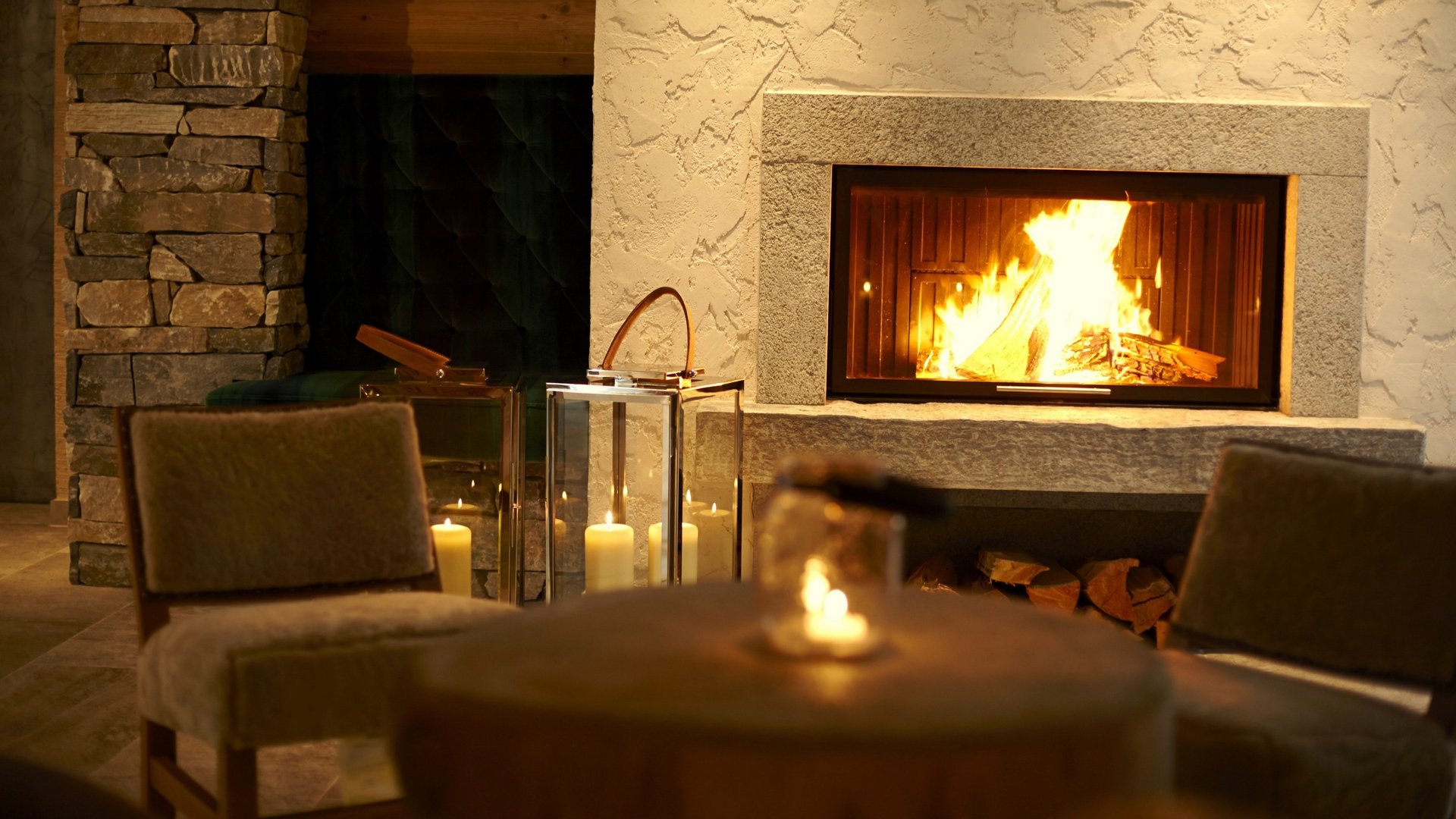 Hotel Sonnenhof Cozy fireplace with burning fire and candles in a warm room